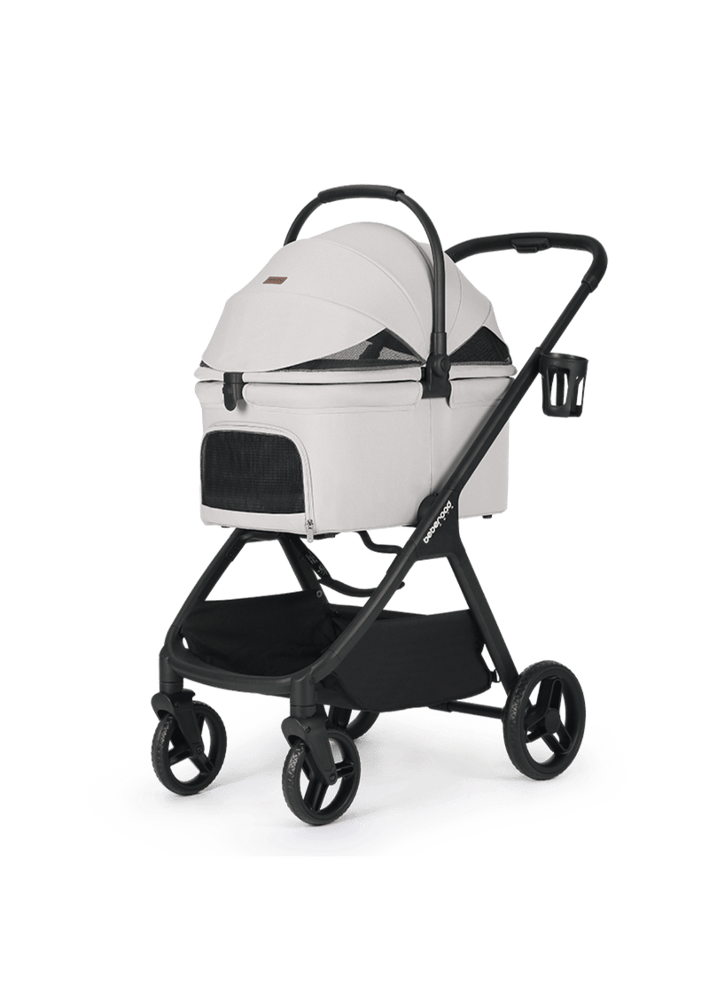 A stylish light gray pet stroller featuring an enclosed canopy with mesh panels for ventilation and a large storage basket underneath.
